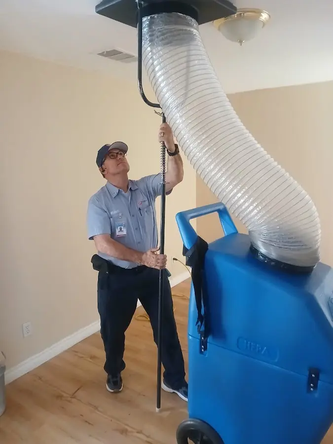 HVAC Installation technician using HEPA equipment in Justice